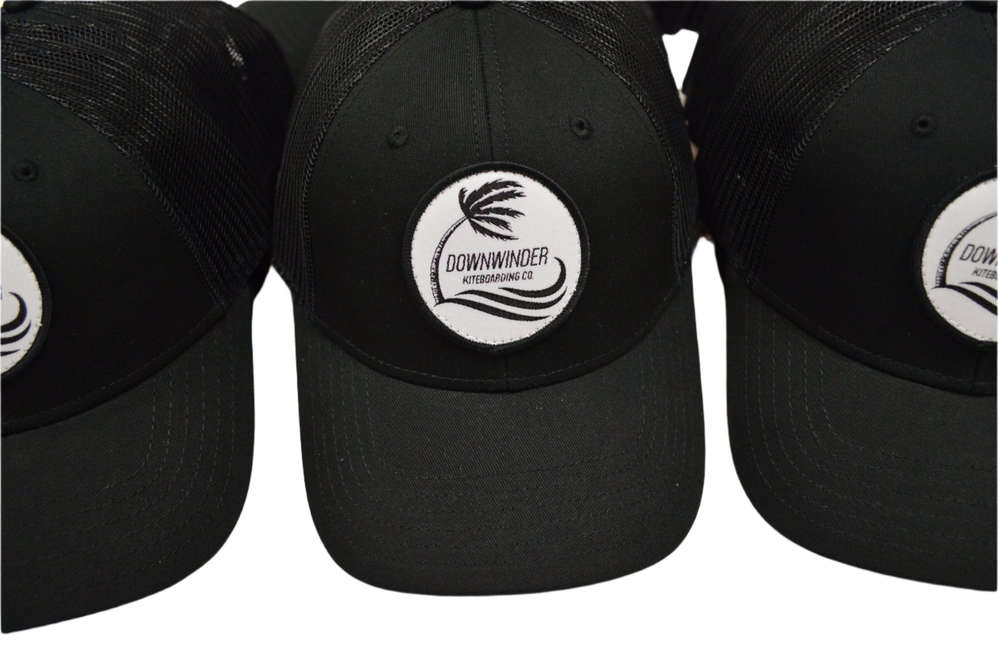 Black Hat with a patch of the Downwinder Kiteboarding Co. Logo